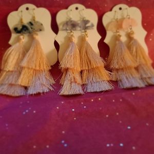 Half moon shaped tassle earrings